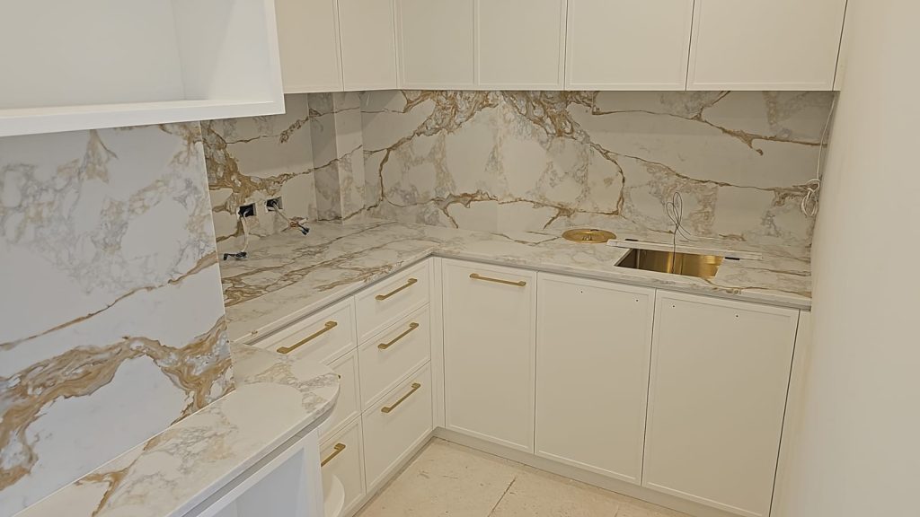 Stylish butler’s pantry with ample shelving, integrated appliances, and a ZIP tap for instant boiling water.